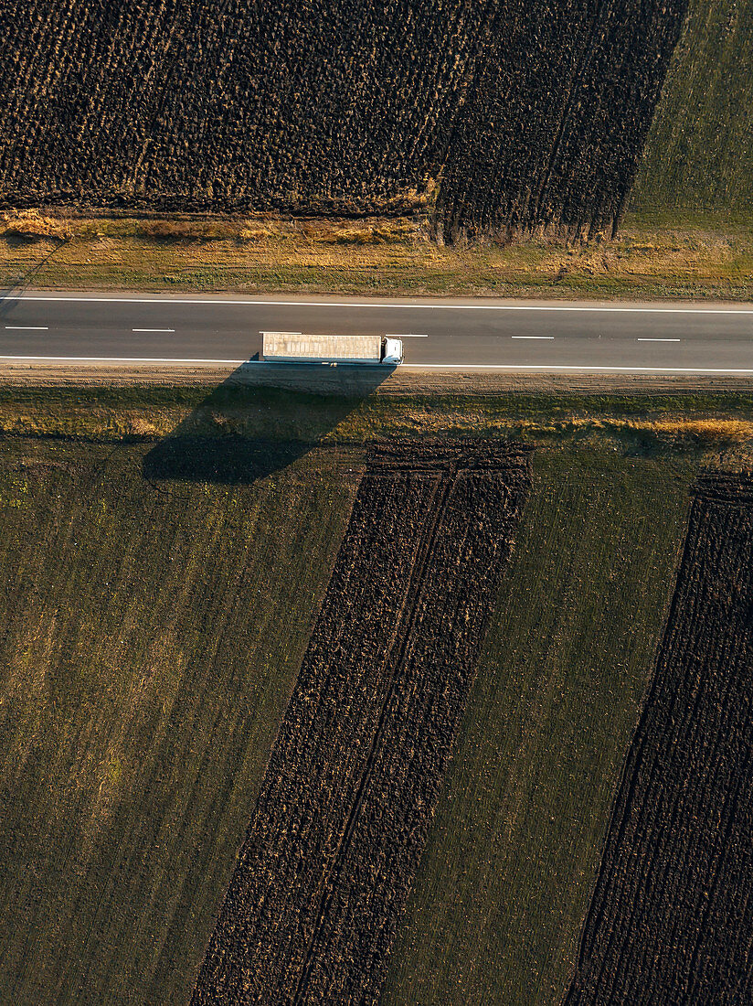 Lorry on rural road, aerial view