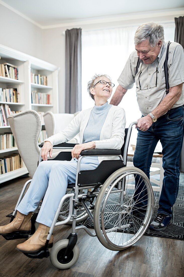 Woman in wheelchair with man