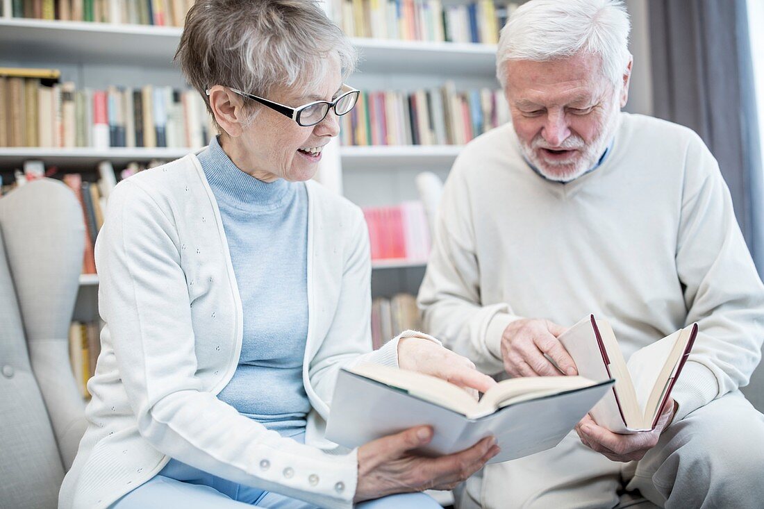 Senior couple reading books