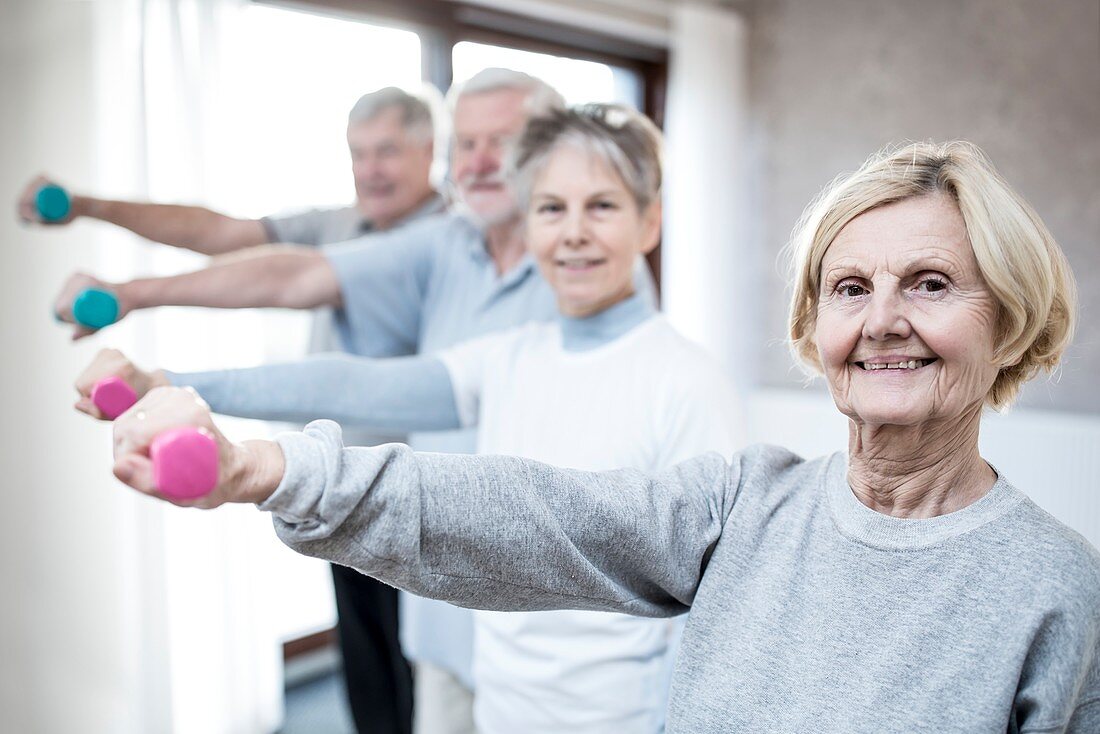 Seniors holding hand weights