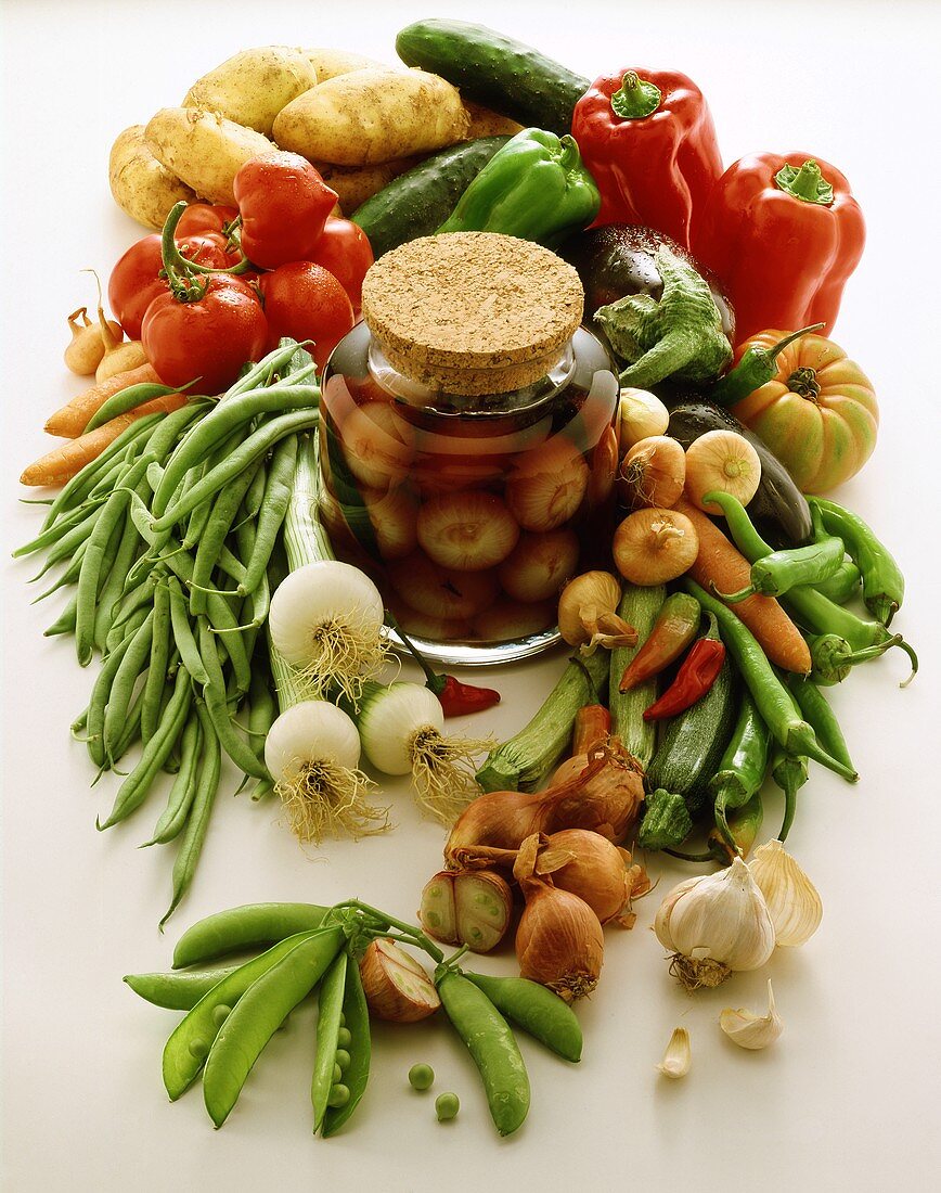 Still life with fresh vegetables & pickled spring onions