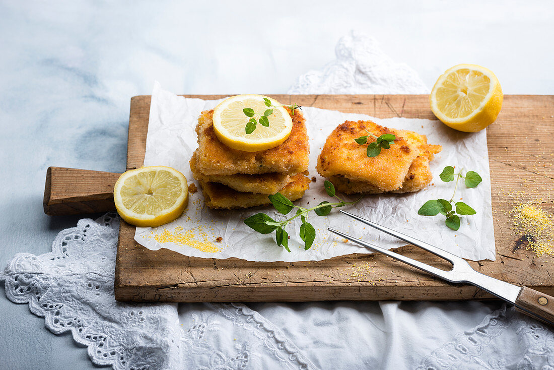 Vegan corn cutlets (made with polenta and sweetcorn) with lemon