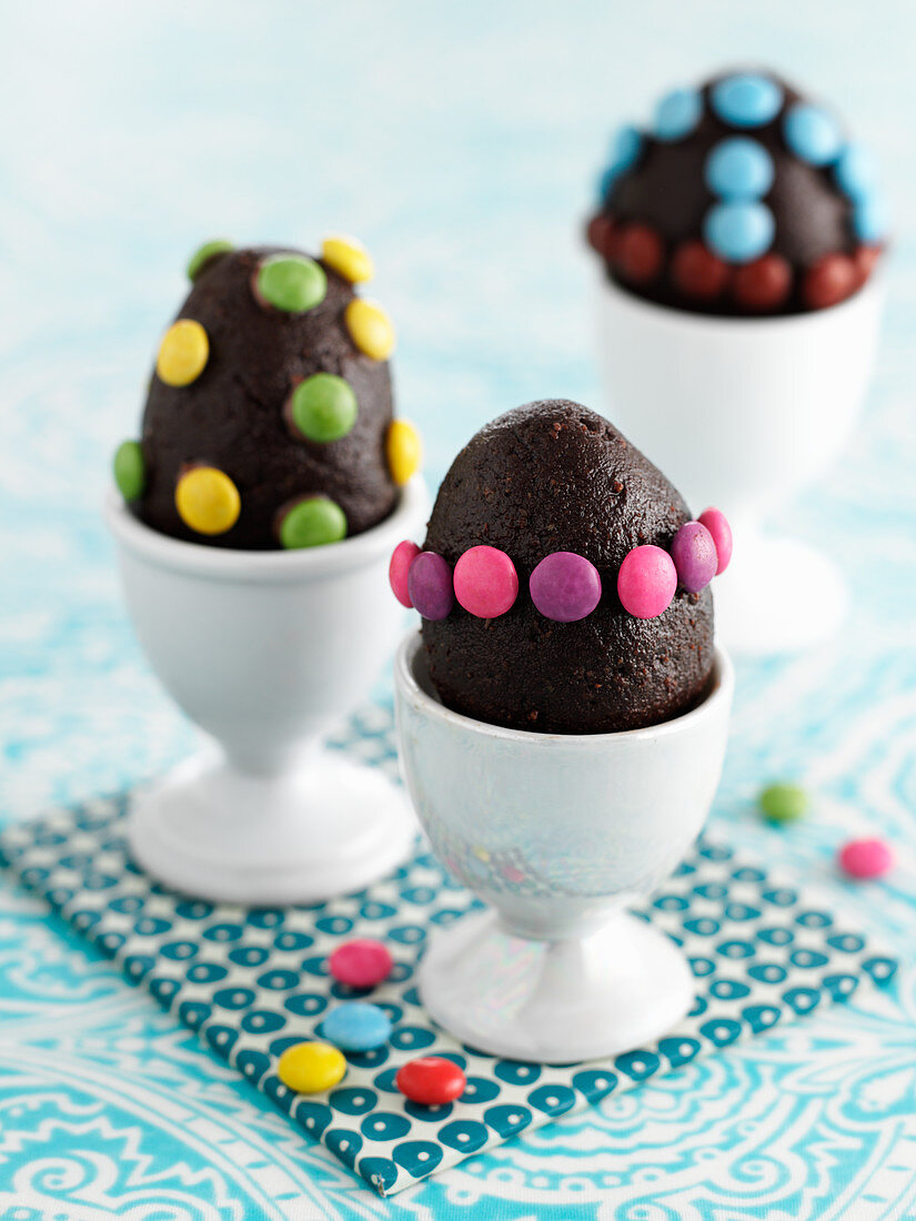 Chocolate eggs with colorful chocolate beans