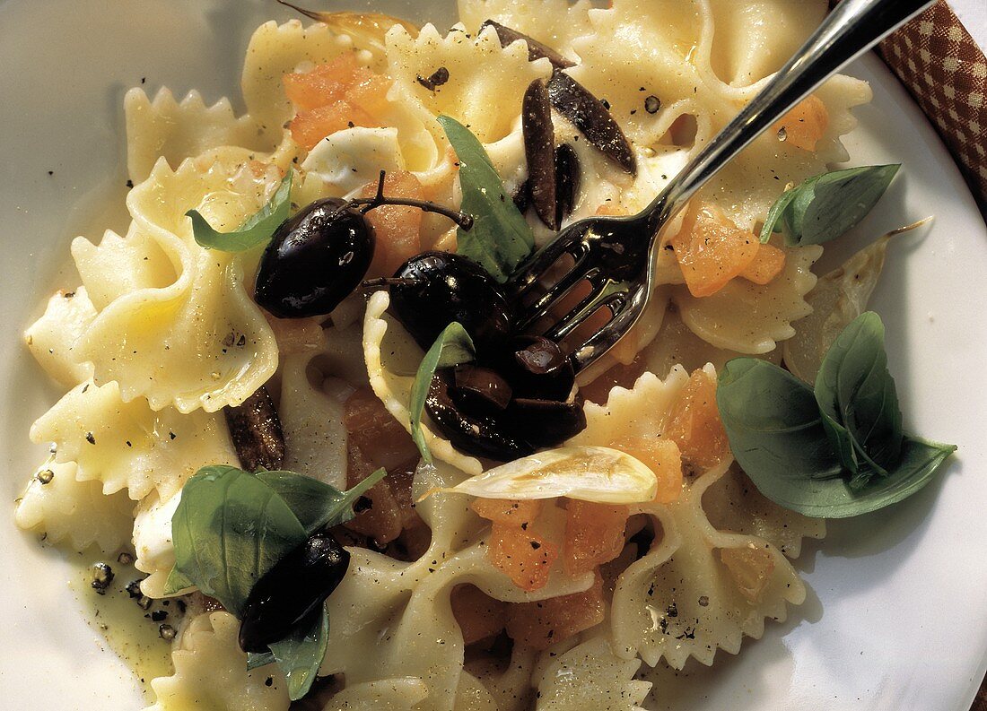 Close Up on Farfalle Pasta with Tomatoes and Olives