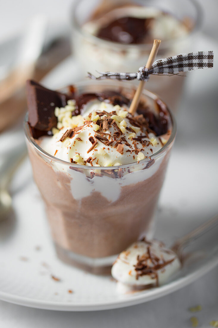 Chocolate ice cream with cream and nuts