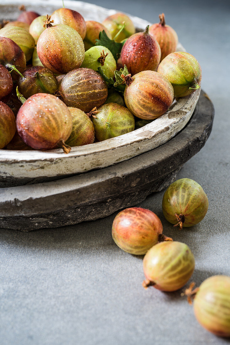 Gooseberries in a stone bowl