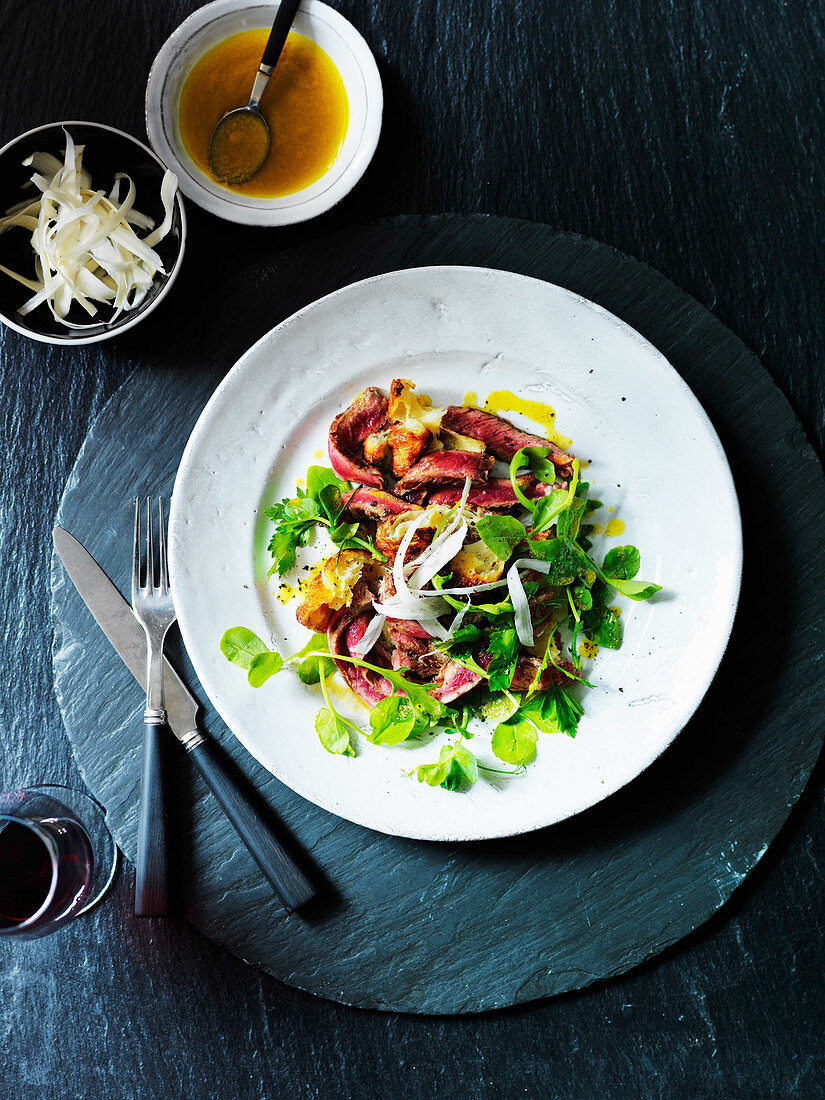 Beef salad with yorkshire pudding, rocket and parsley