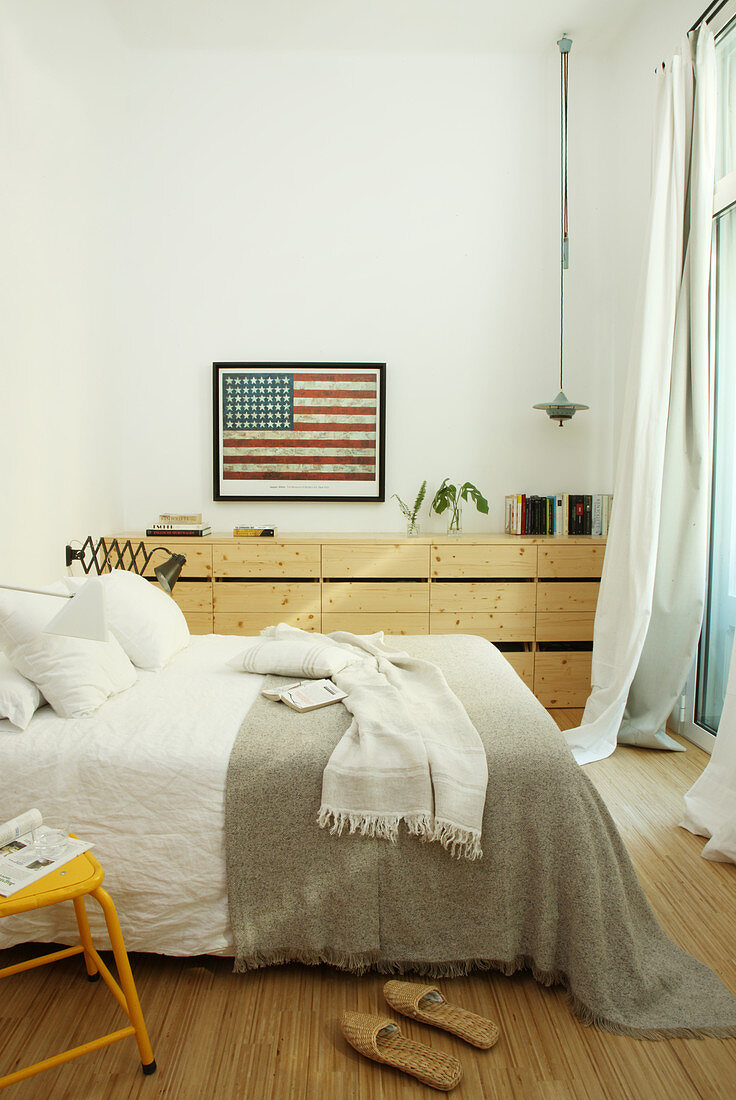 Picture of American flag in bedroom in natural shades