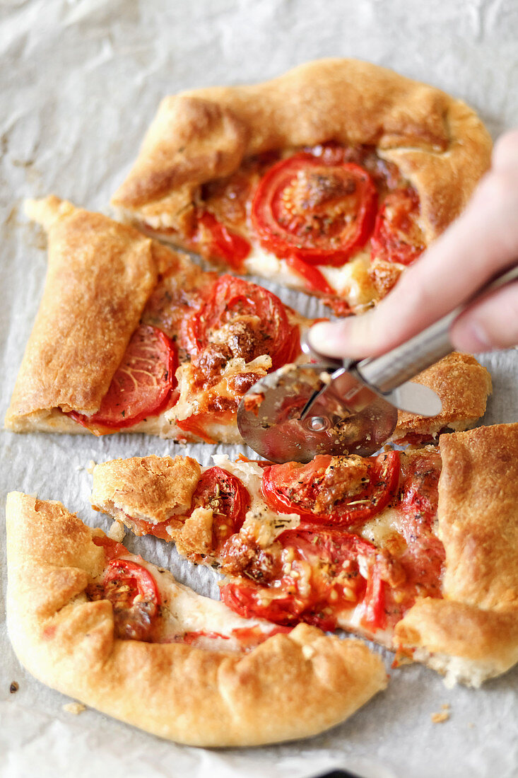 A homemade pizza with tomatoes