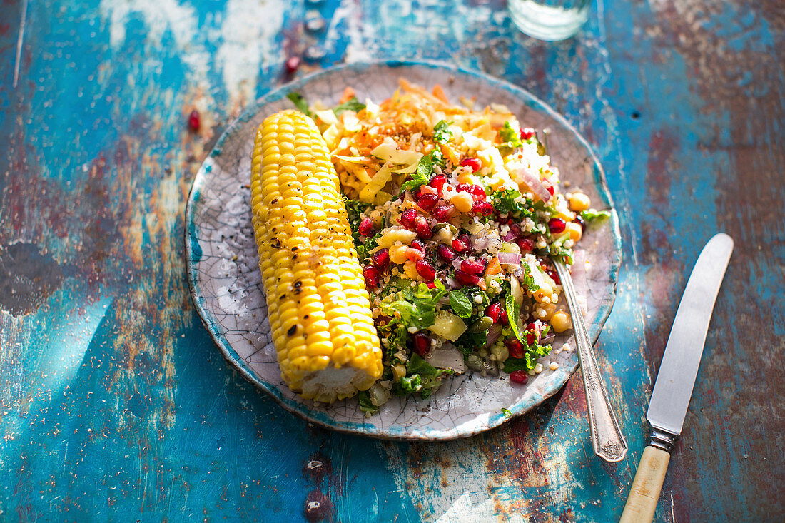 Quinoa salad with chickpeas, kale and corn on the cob