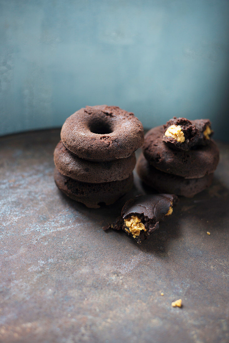 Vegan chocolate donuts filled with peanut butter