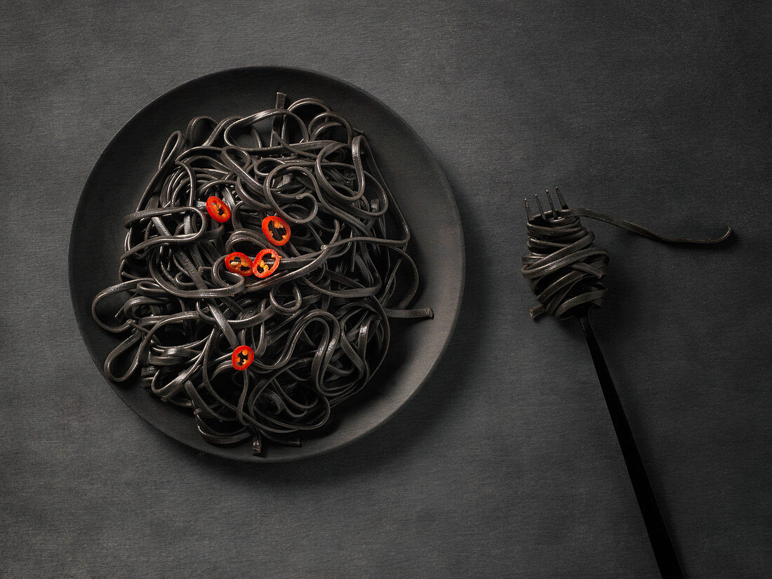 Black pasta with red pepper