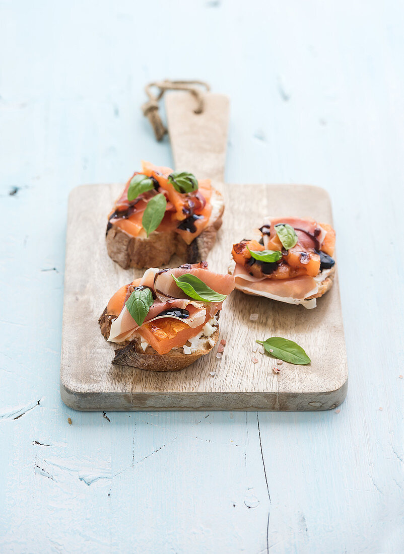 Bruschettas with Prosciutto, roasted melon, soft cheese and basil