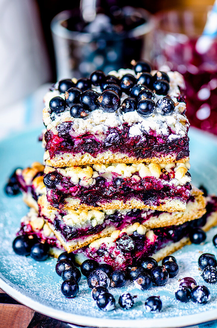 Several pieces of blueberry pie, stacked