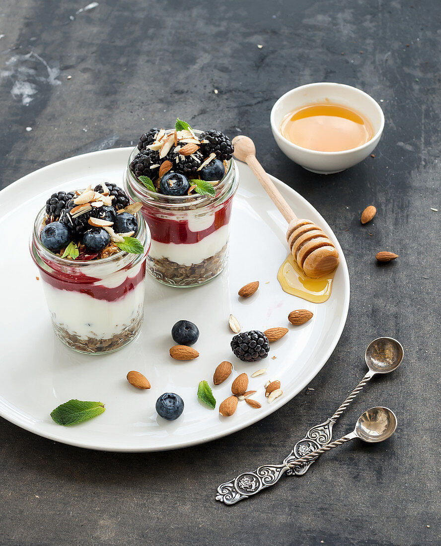Yogurt oat granola with berries, honey and nuts