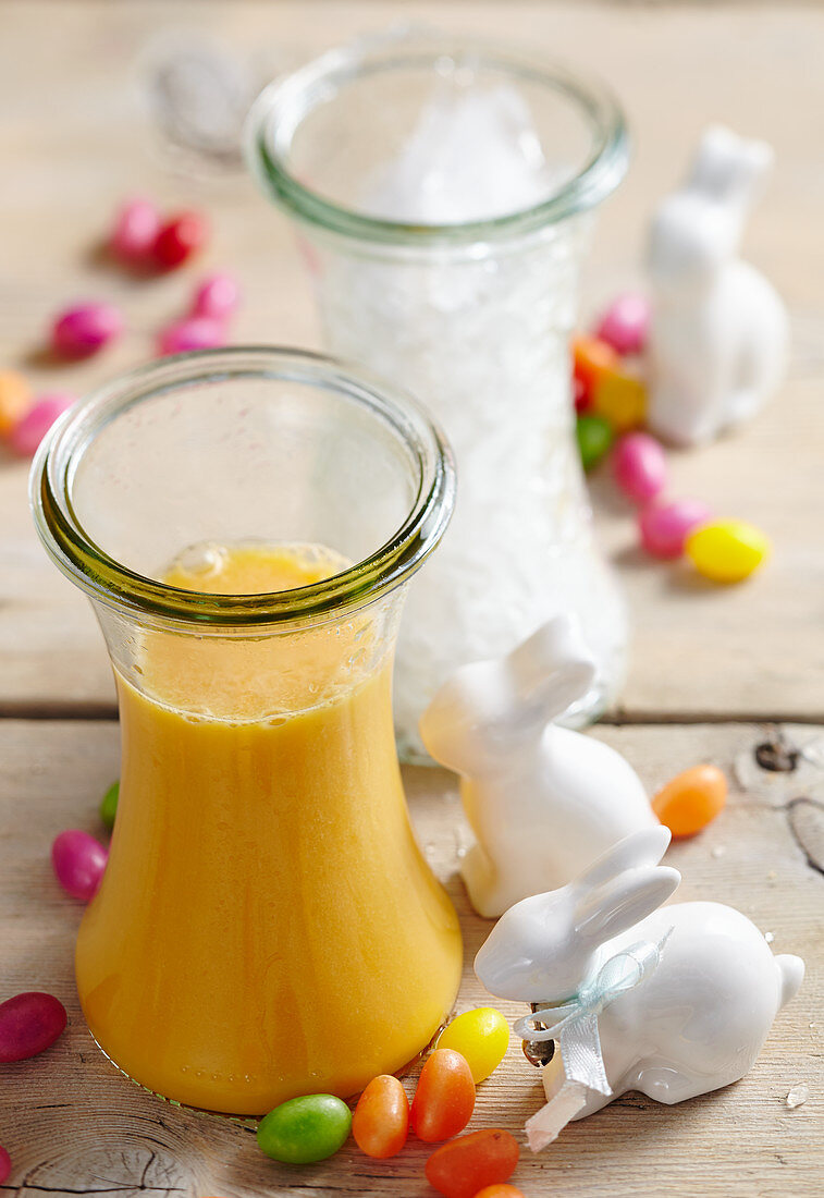 Carrot and orange smoothie with yoghurt and honey for Easter