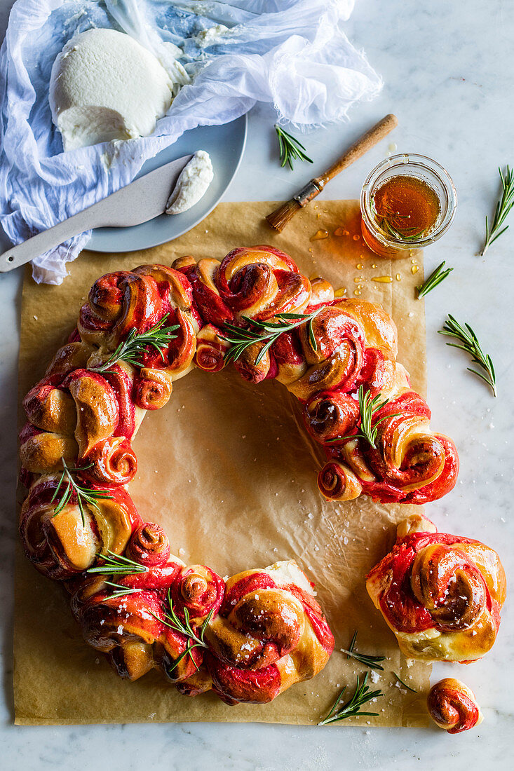 A beetroot bread wreath with rosemary