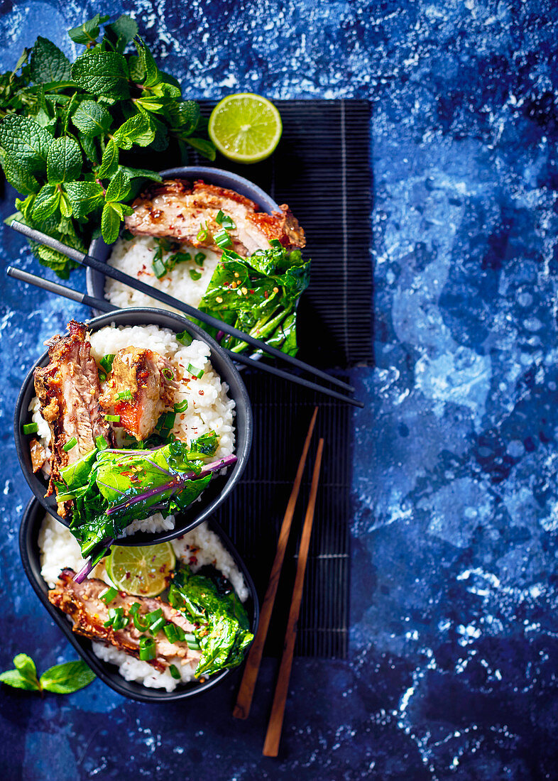 Coconut and lemongrass asian bowls with slowcooked pork belly and flash-fried greens