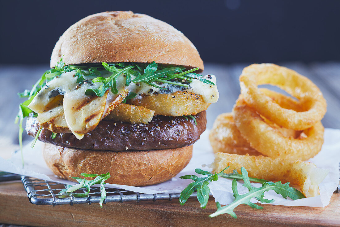 Burger with grilled pears and onion rings