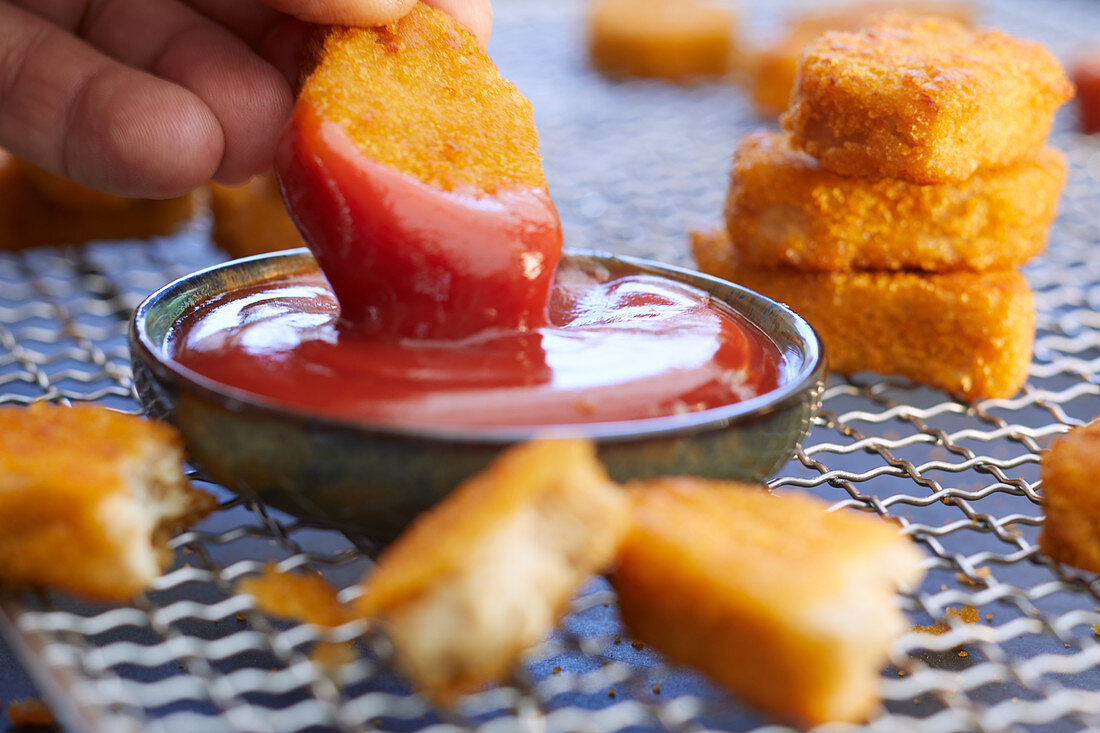 Chicken Nuggets with Ketchup; One Halved