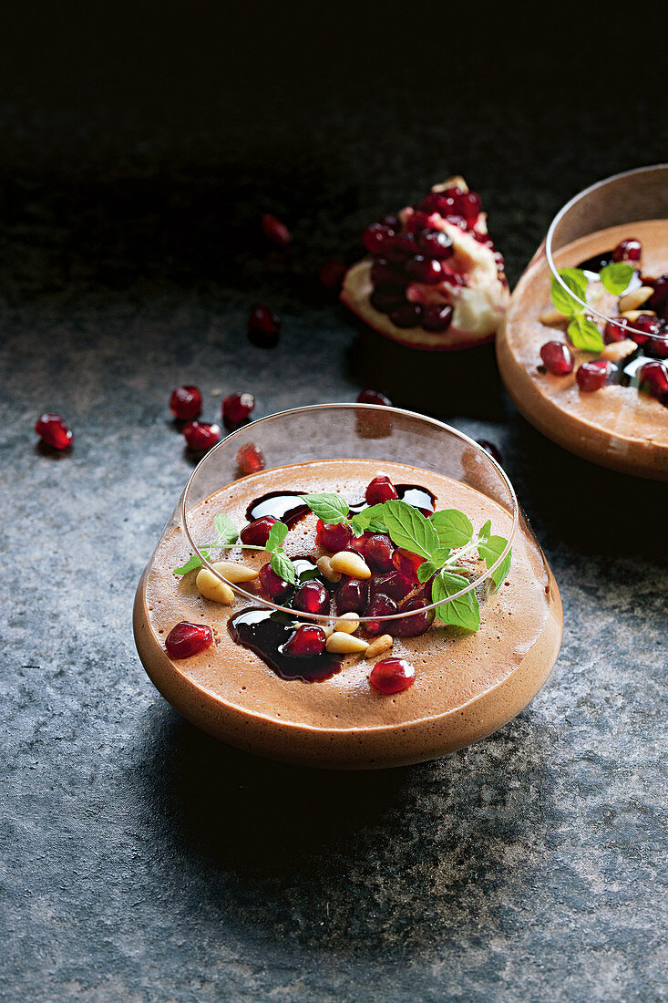 Choc mousse with pine nuts and pomegranate