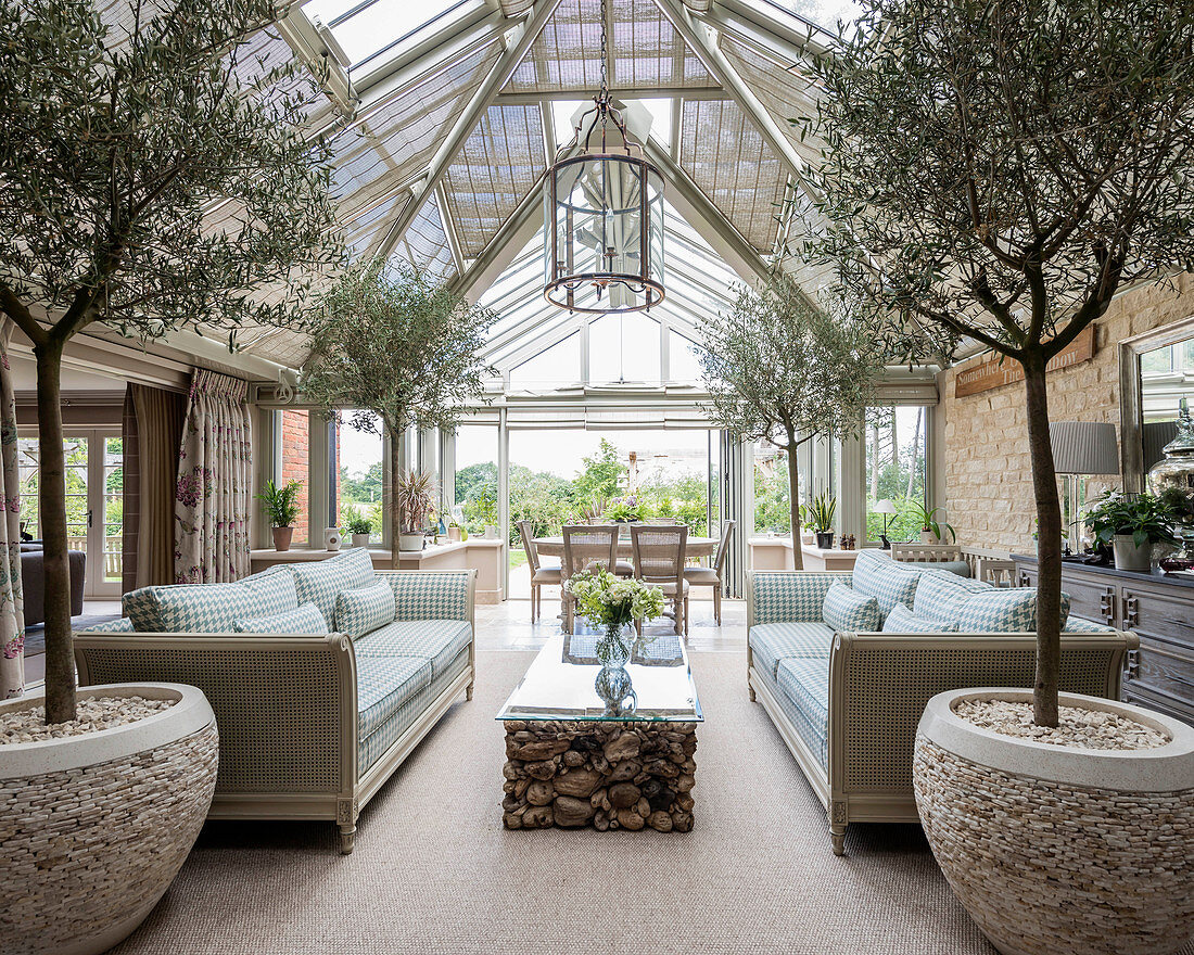Large, elegant interior with glass roof and conservatory