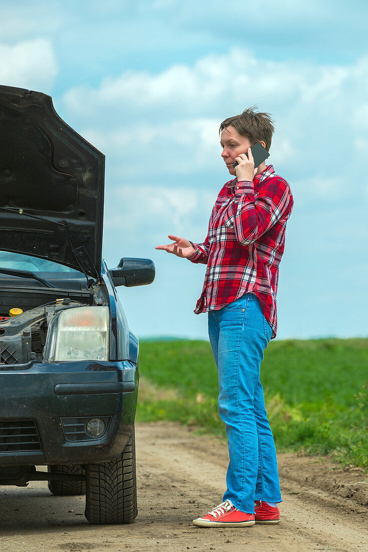 Woman with broken downcar