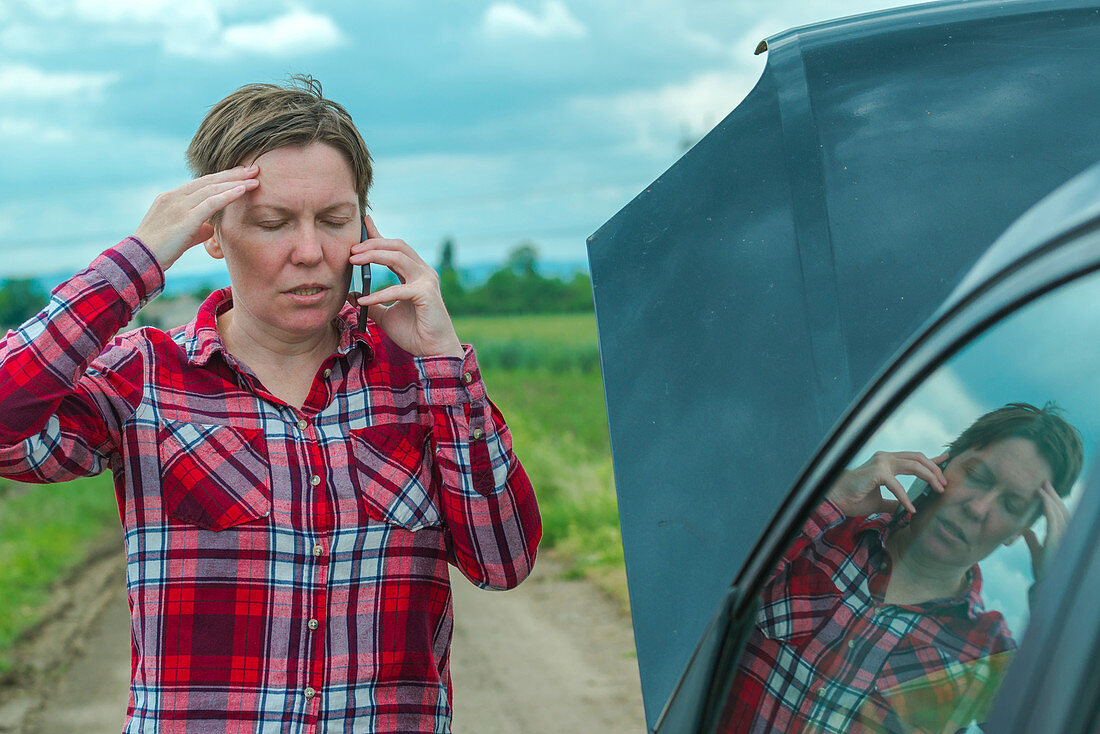 Woman with broken downcar