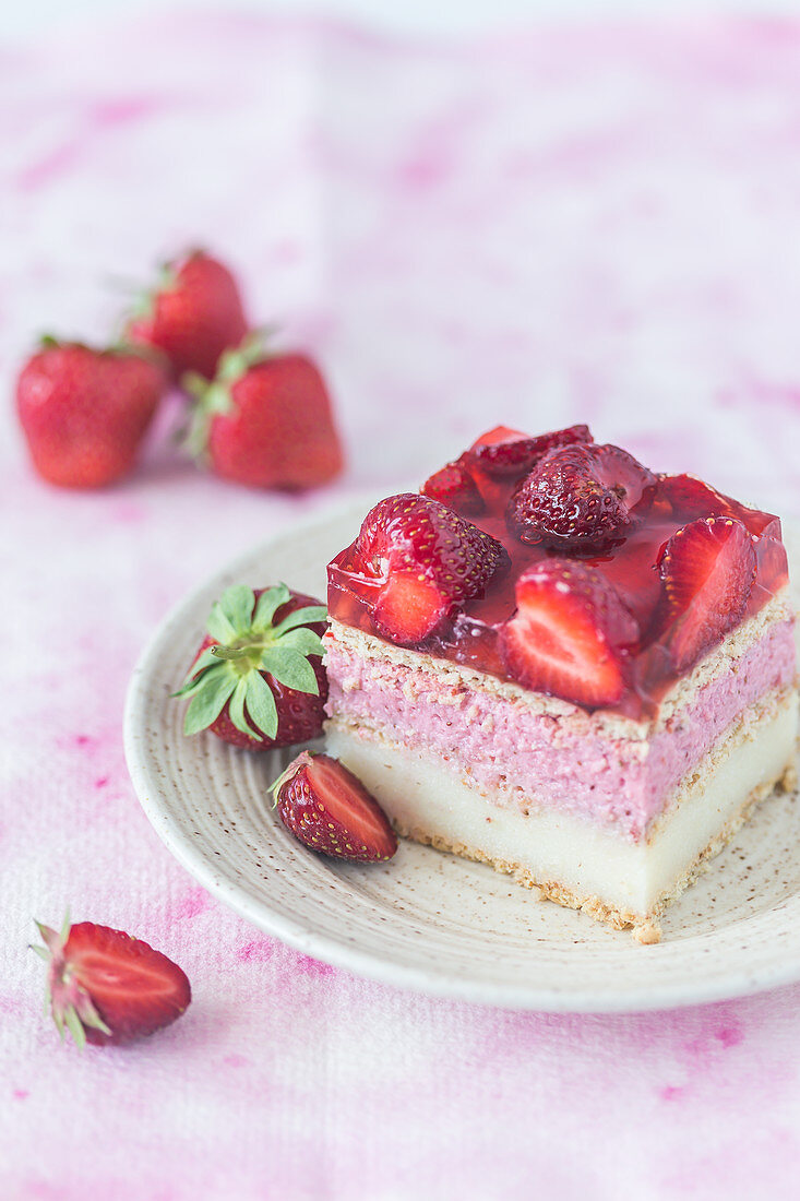 A slice of strawberry vanilla cream fridge cake