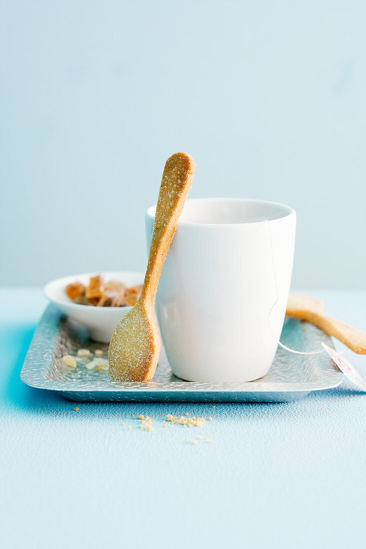 A biscuit spoon and tea