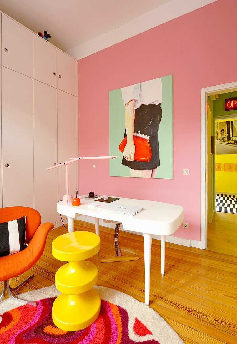 White cupboards and desk in study