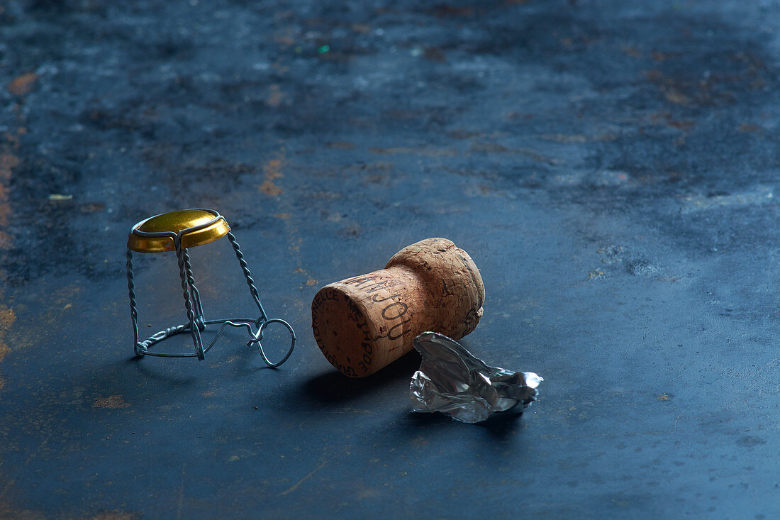 Champagne corks, an agraffe and silver foil