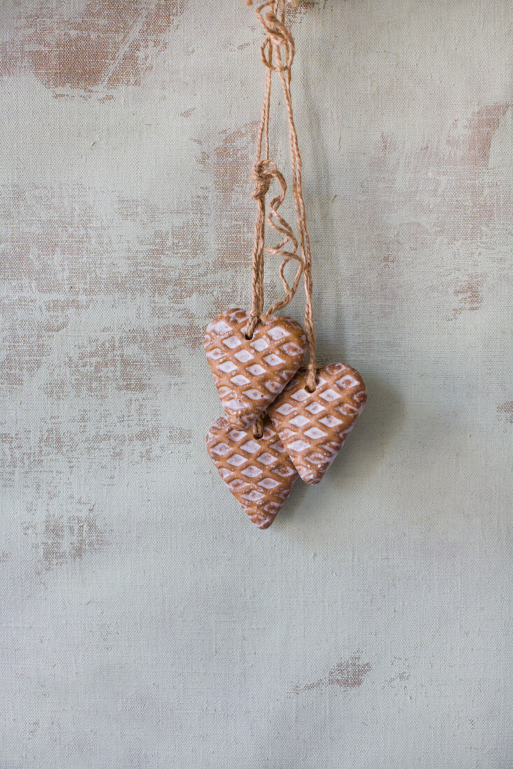 Gingerbread hearts hung on wall
