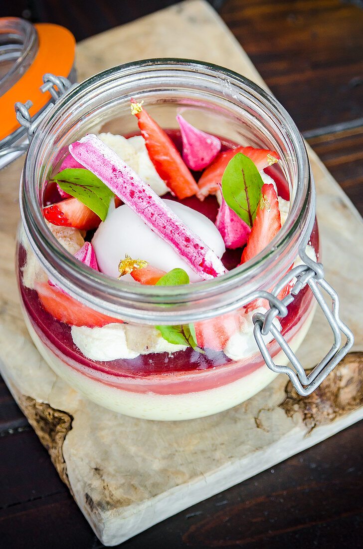 Strawberry panna cotta with raspberry meringue, strawberries, vanilla ice cream and peppermint
