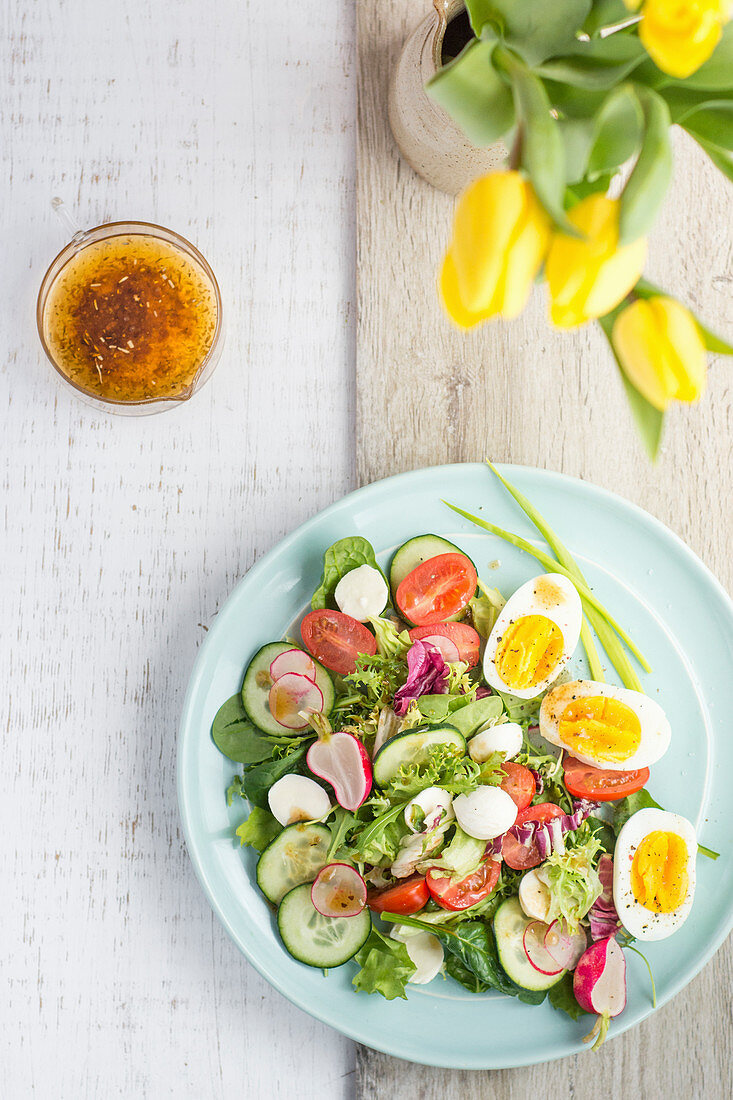 Spring vegetable salad with cooked egg