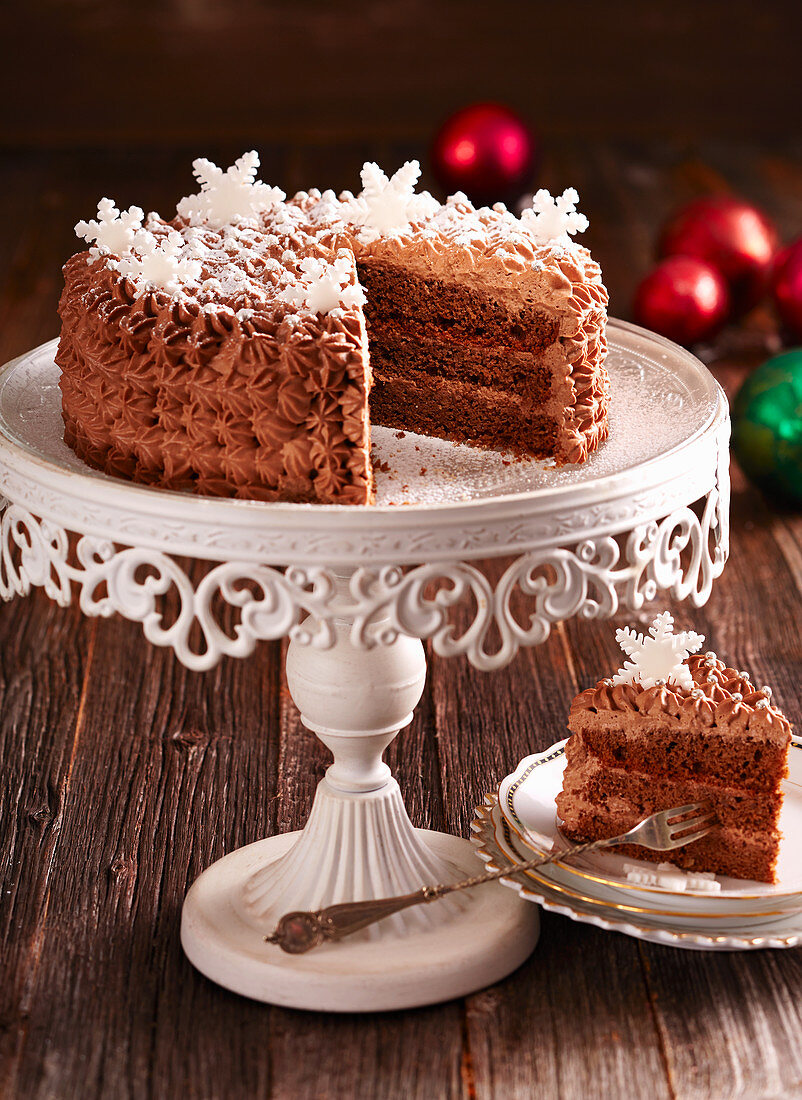 A festive rum-truffle cake with chocolate cream and fondant snowflakes