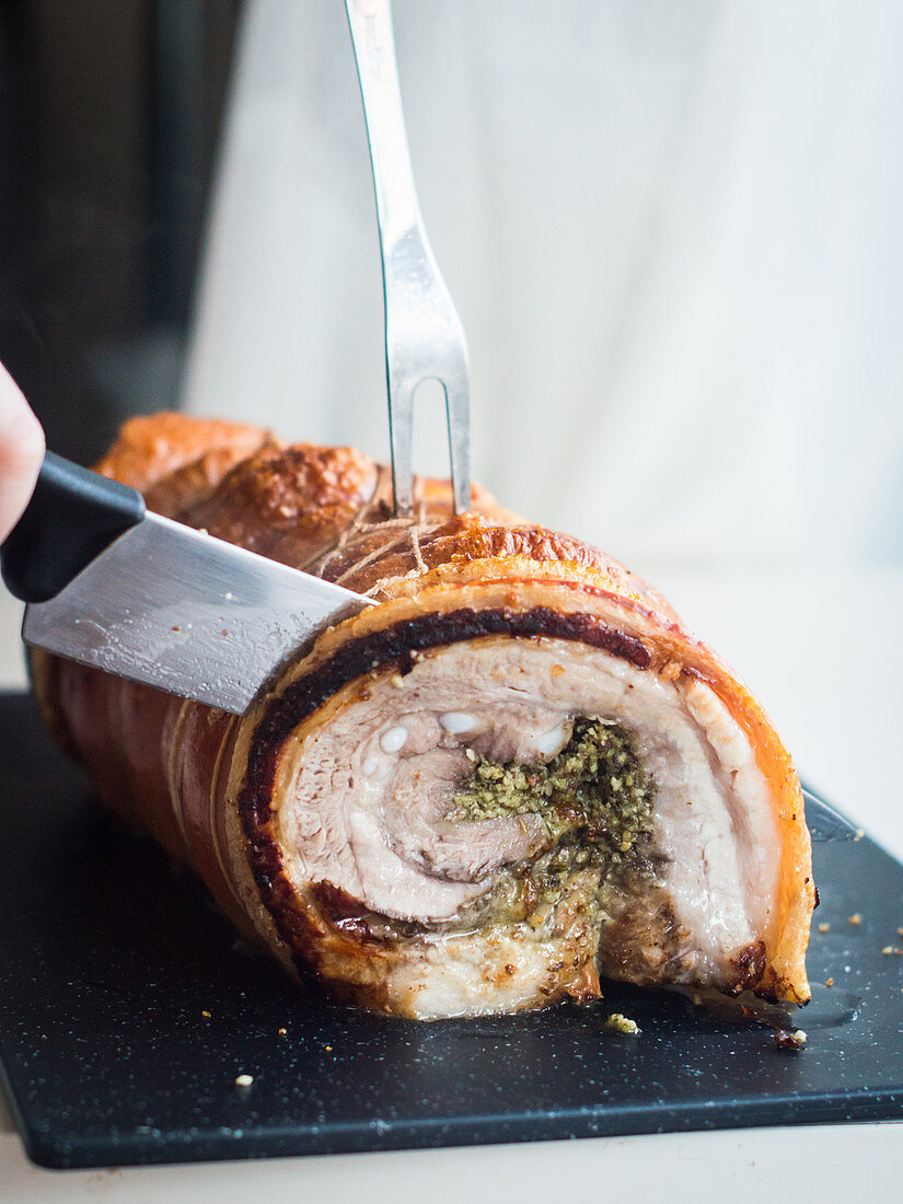 Sliced porchetta (pork belly roll, Italy)