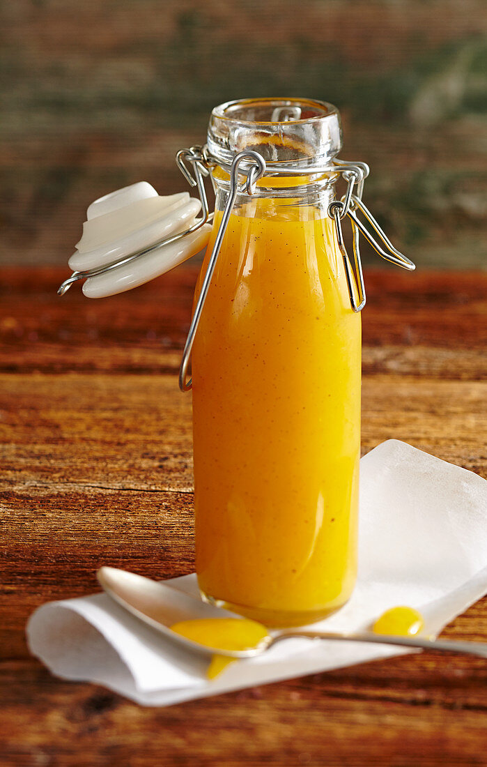 Homemade mango syrup with vanilla and lemon