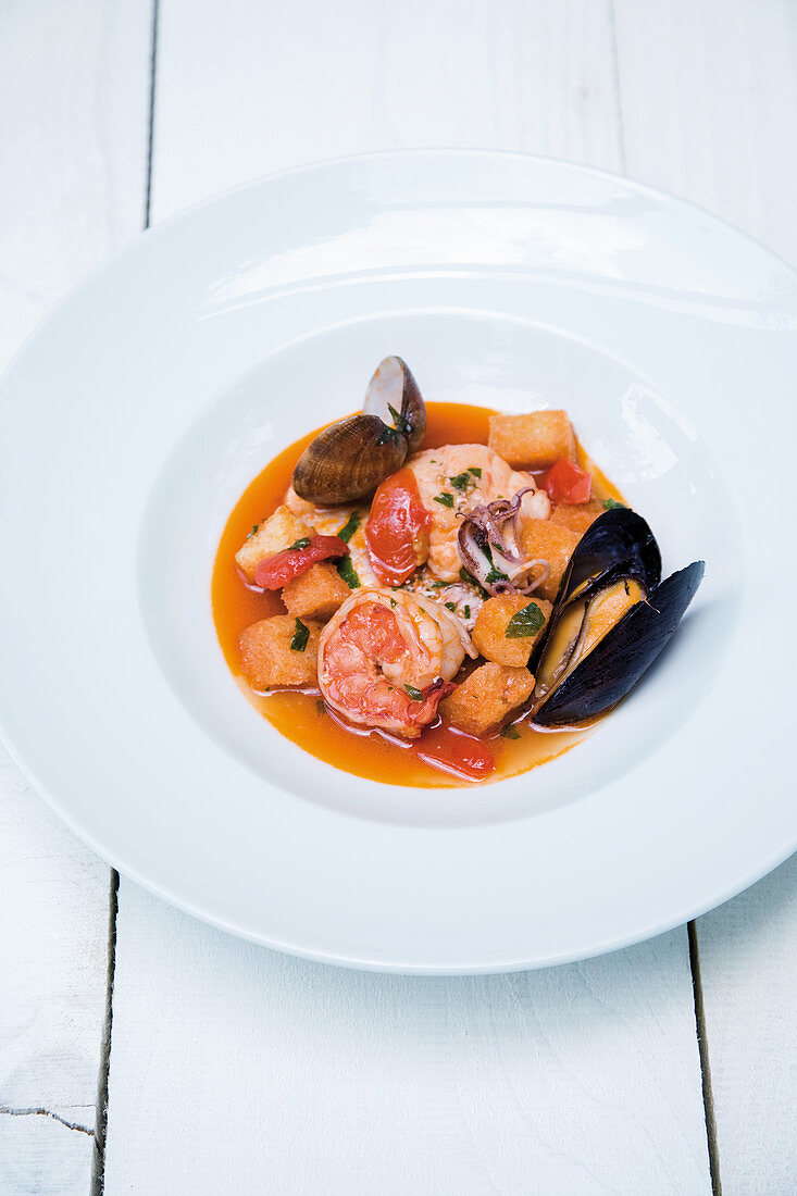Sorrento fish soup with prawns, octopus, mussels, tomatoes, parsley and pepperoni