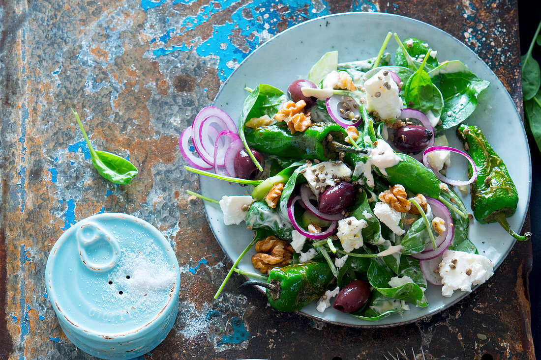 Greek salad with pimientos de padrons, feta cheese, spinach, olives and walnuts