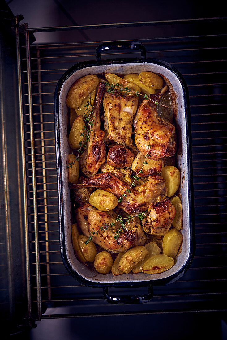 Oven-roasted rabbit with potatoes (seen from above)