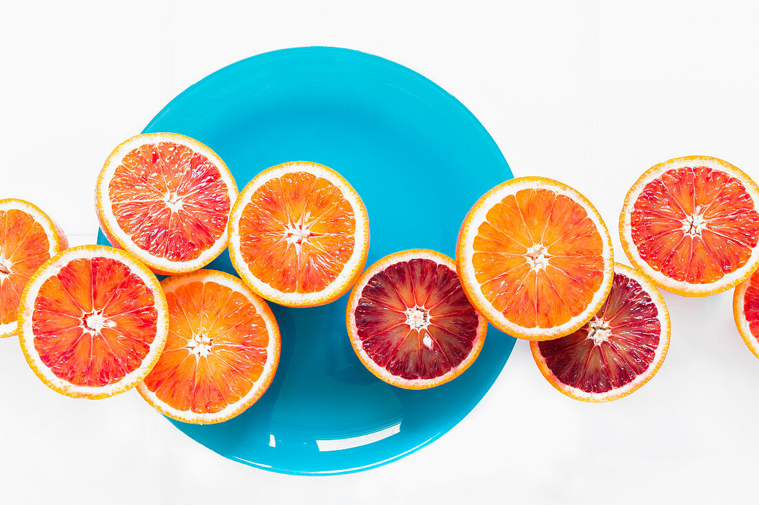A row of halved Moro blood oranges