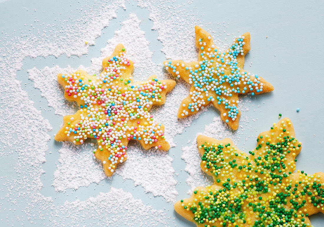 Star-shaped biscuits with colourful sugar sprinkles