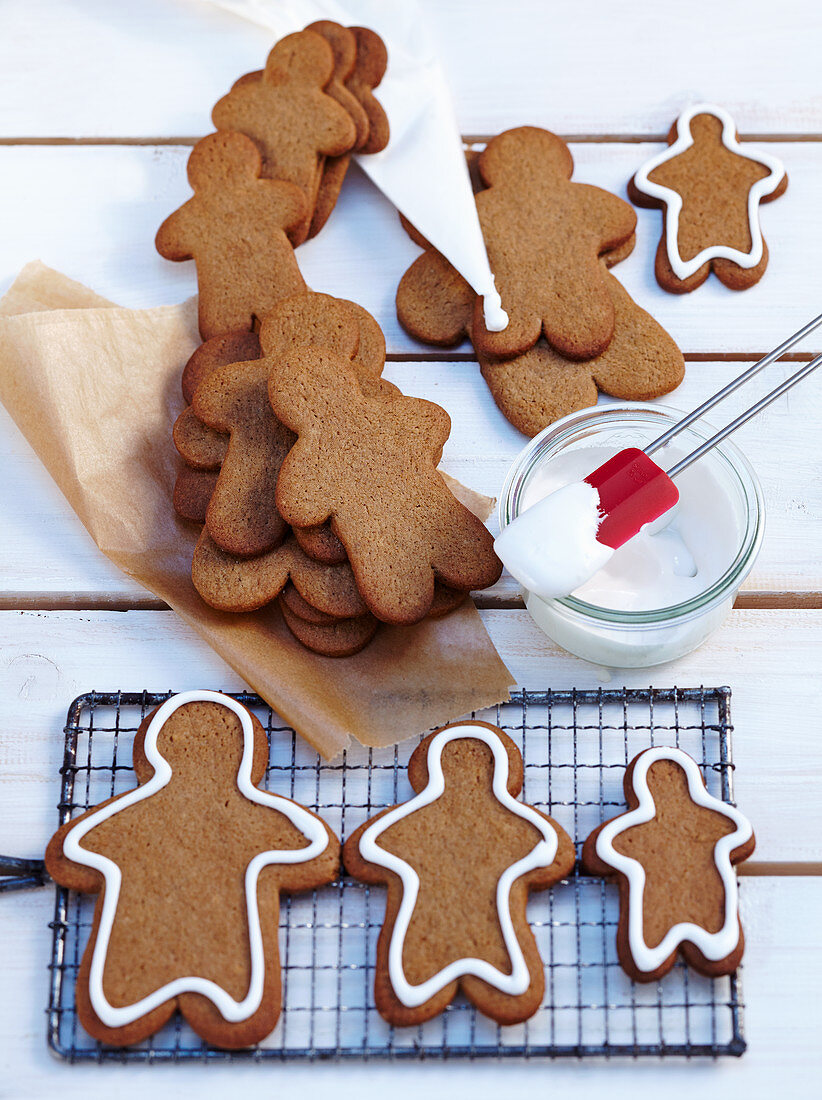 Pepparkakor (gingerbread men, Sweden) being decorated with icing