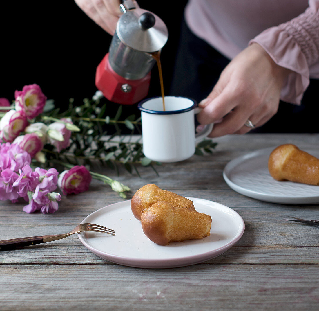 Mini baba au rhum with coffee