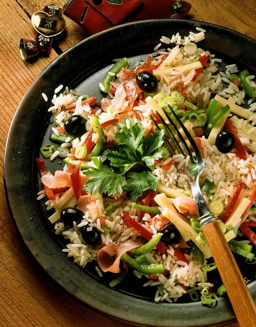 Rice salad with ham, salami, olives, cheese & pepper