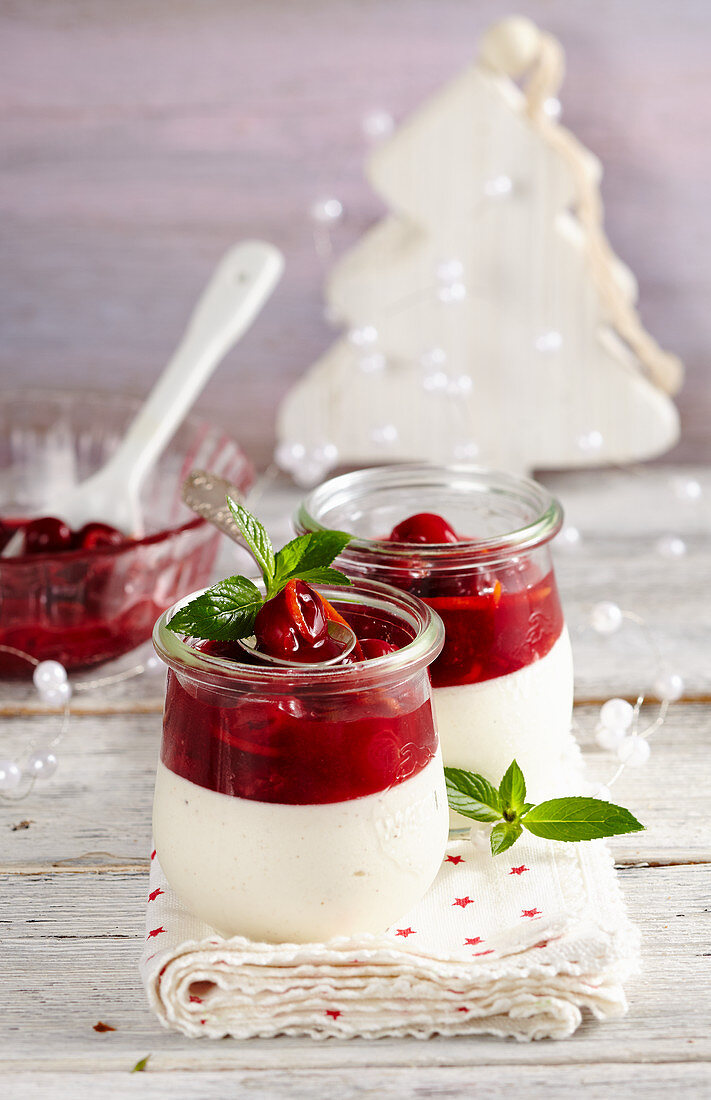 Gingerbread mousse with punch cherries in jars