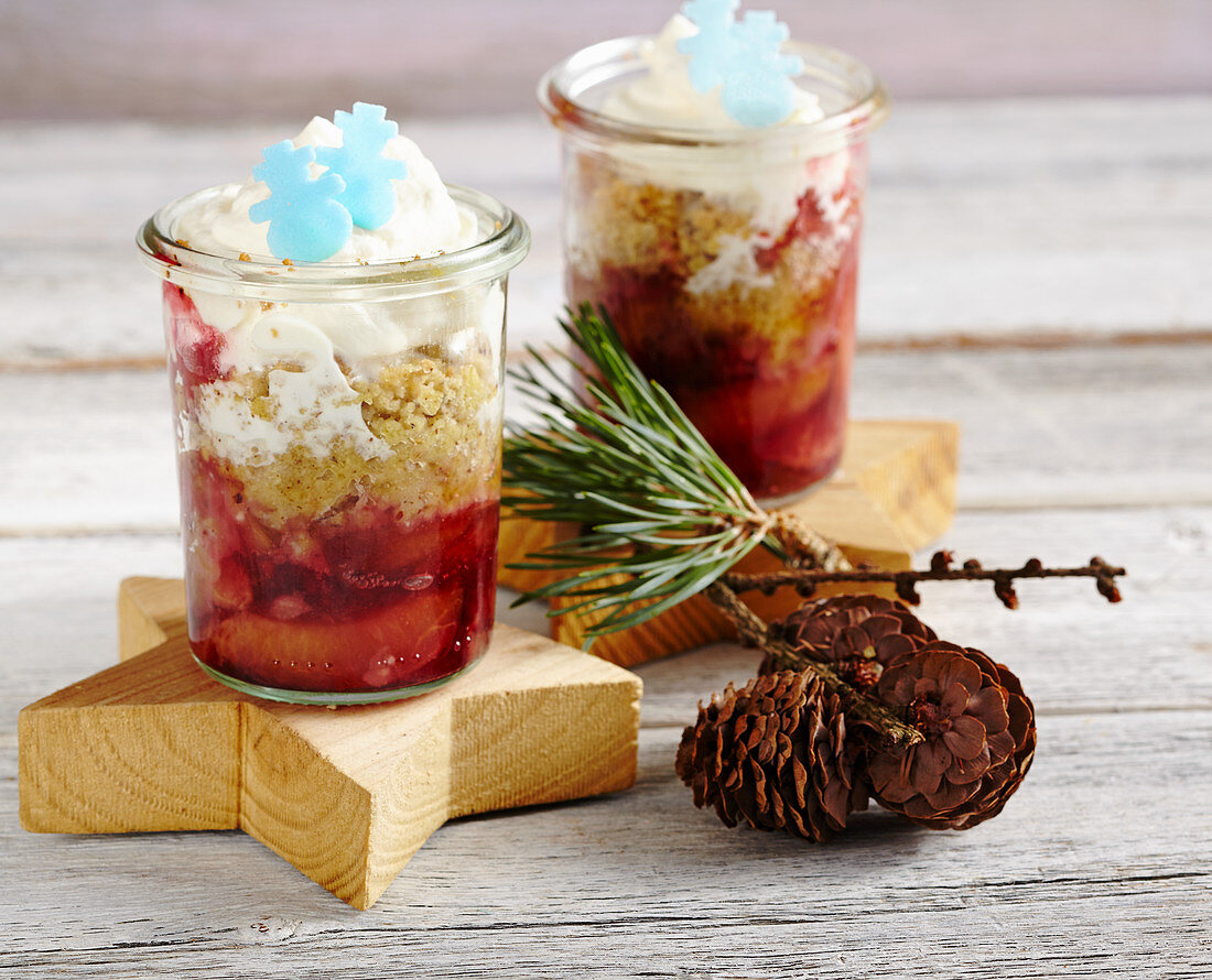 Punch damsons with cinnamon and orange crumble and whipped cream in jars
