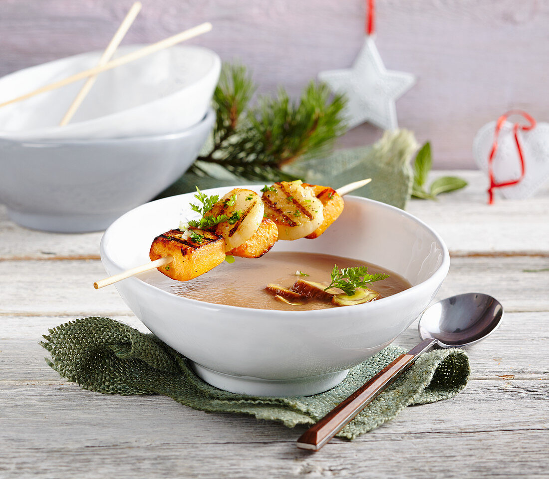 Chestnut soup with Port wine, and anise and grilled scallop and sweet potato skewers
