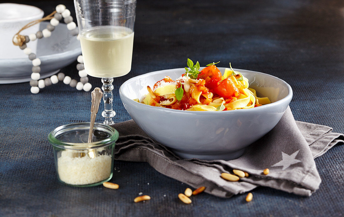 Tagliatelle with vegetable sauce and pine nuts